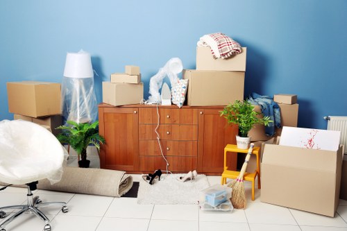 Trained movers using PPE during a relocation task