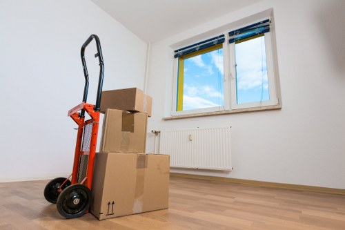 Removal crew handling household items during a central London move