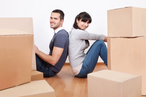 Removal team handling boxes and furniture in a Marylebone flat move