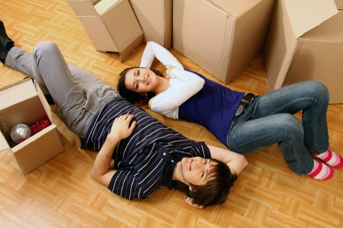 Professional movers organising packed items for a flat in Marylebone
