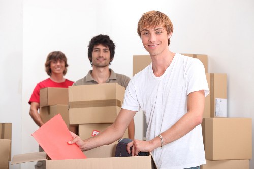 Fragile household items being carefully boxed for transport in central London