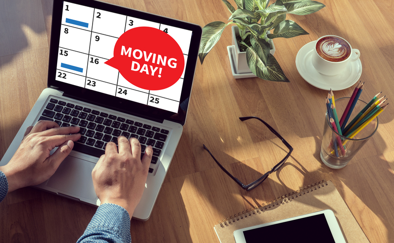Professional movers handling boxes and furniture in a Marylebone flat move